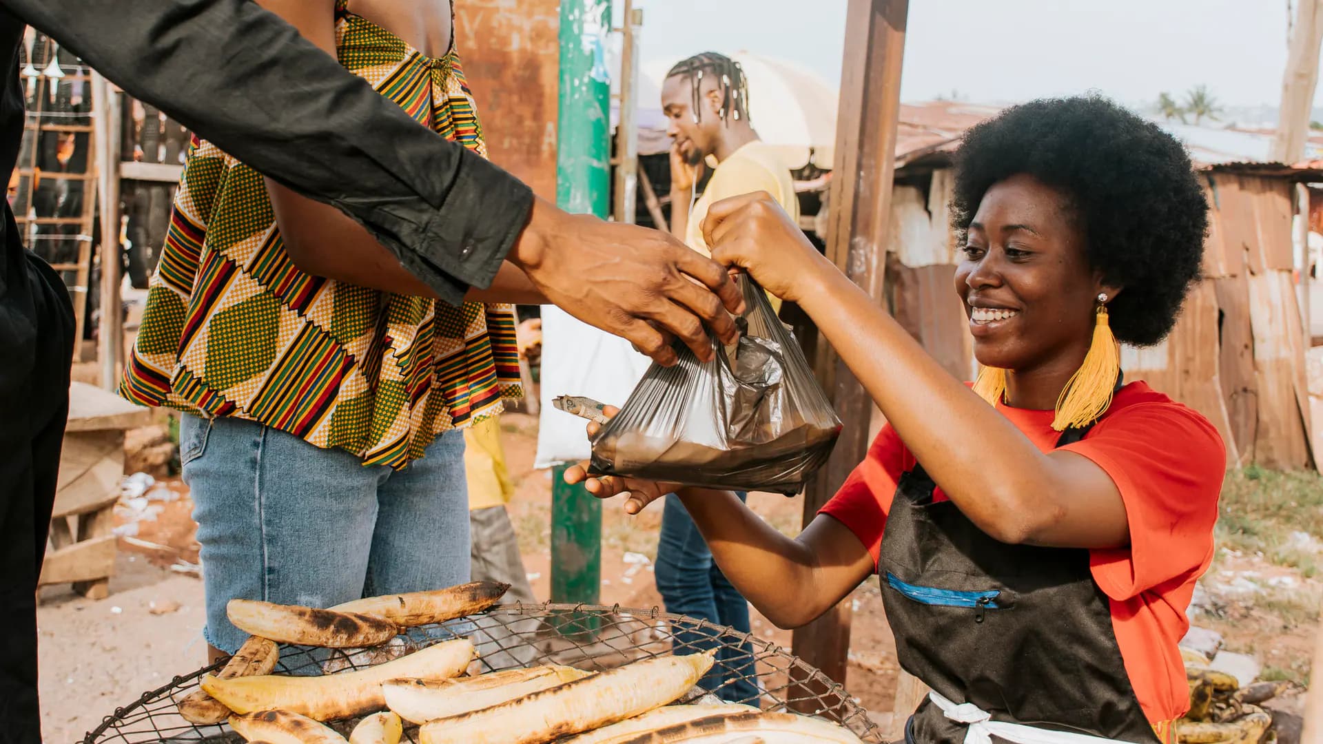 Woman running a small food enterprise in her community
