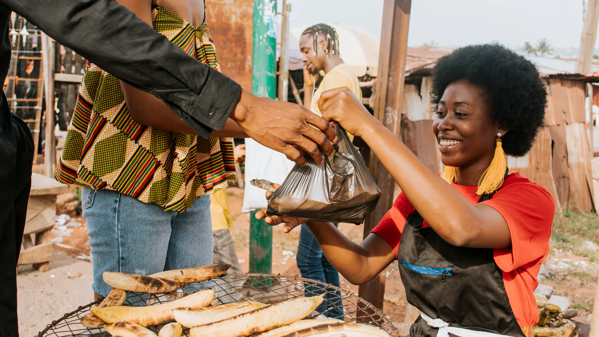 Woman running a small food enterprise in her community