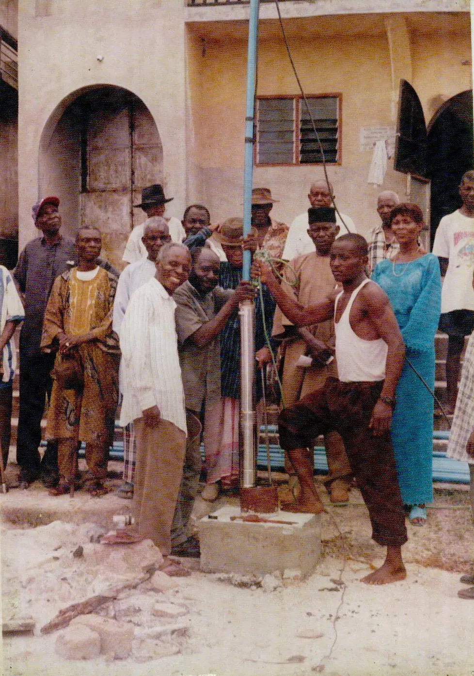 Community members gathered around a newly installed water point