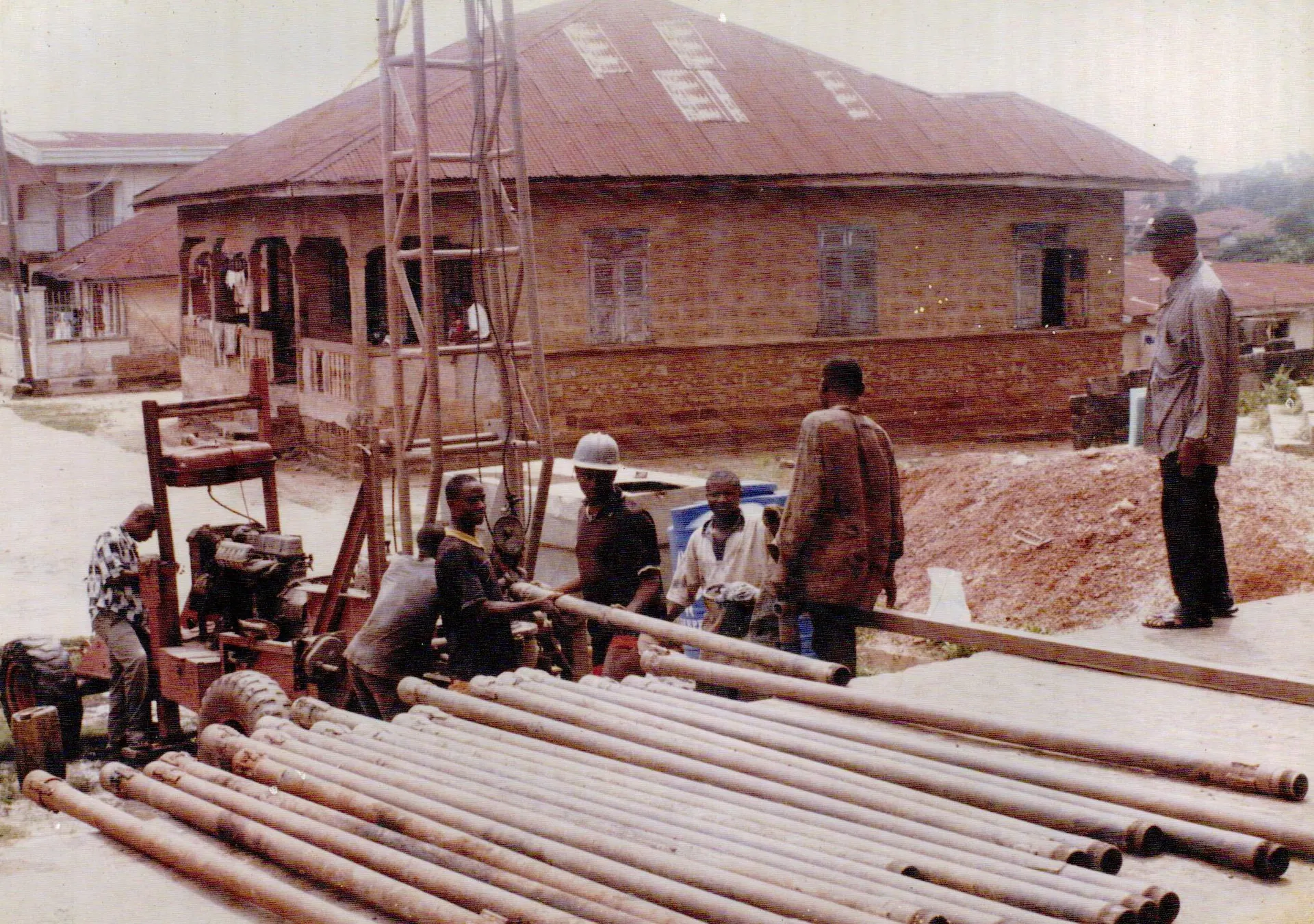 Workers installing pipes for a community water project.